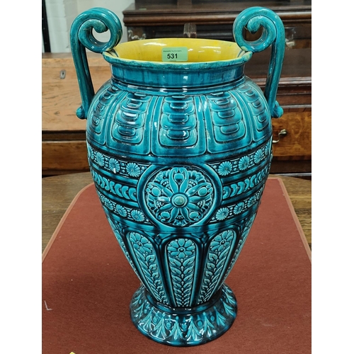 531 - A large majolica style vase by Linthorpe, of baluster form with twin scroll handles, in turquoise gl... 