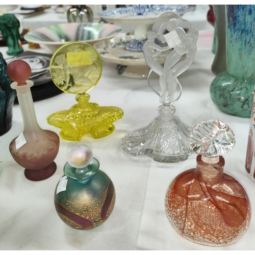 544 - An Art Nouveau pair of glass scent bottles with etched female figures to the stoppers; 3 other scent... 