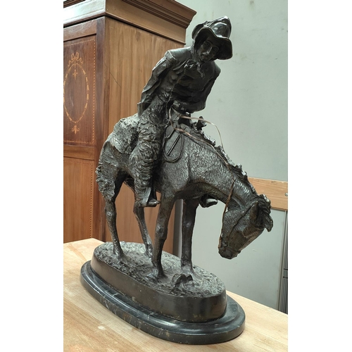 59 - Follower of Fredric Remmington, Cowboy on horse back, bronze, bears signature, marble plinth height ... 