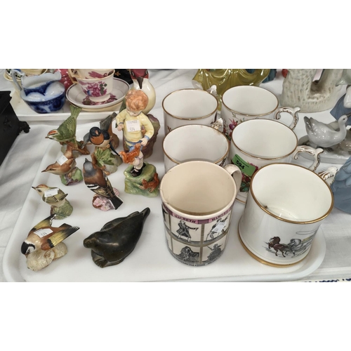 594 - A Royal Worcester figure of a boy; a Royal Worcester bird; a selection of mugs