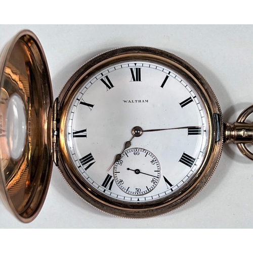 604 - A Waltham keyless half hunter pocket watch in 9 carat hallmarked gold, with engine turned decoration... 