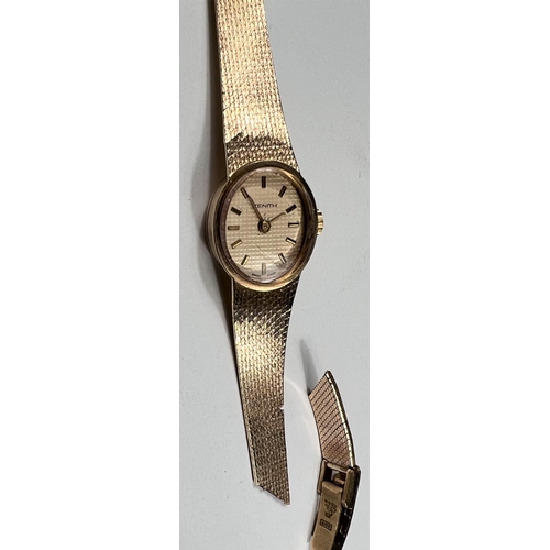 605 - A ladies 9 carat hallmarked gold wristwatch with oval dial and integral 9 carat hallmarked gold stra... 