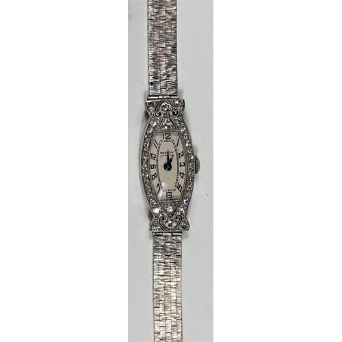 606 - A ladies Art Deco cocktail watch in 9 carat hallmarked white gold, by Benson, London, the bezel and ... 