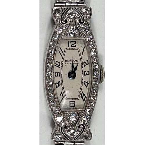 606 - A ladies Art Deco cocktail watch in 9 carat hallmarked white gold, by Benson, London, the bezel and ... 