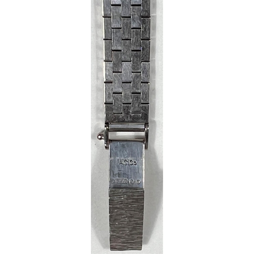 606 - A ladies Art Deco cocktail watch in 9 carat hallmarked white gold, by Benson, London, the bezel and ... 