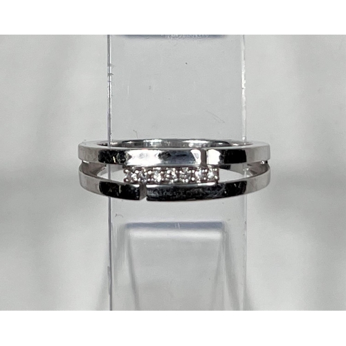 610 - A white gold half eternity ring set 7 diamonds, 2.7 gm