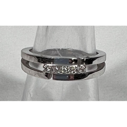 610 - A white gold half eternity ring set 7 diamonds, 2.7 gm