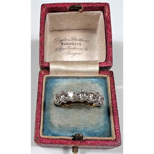 612a - An 18 carat hallmarked gold half eternity ring set 7 diamonds, 3.5mm diameter of stones approx