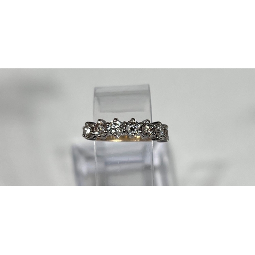 612a - An 18 carat hallmarked gold half eternity ring set 7 diamonds, 3.5mm diameter of stones approx