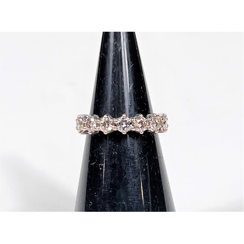 612a - An 18 carat hallmarked gold half eternity ring set 7 diamonds, 3.5mm diameter of stones approx