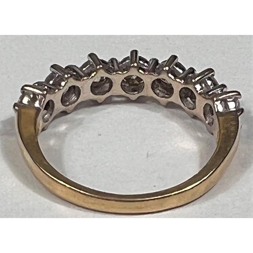 612a - An 18 carat hallmarked gold half eternity ring set 7 diamonds, 3.5mm diameter of stones approx