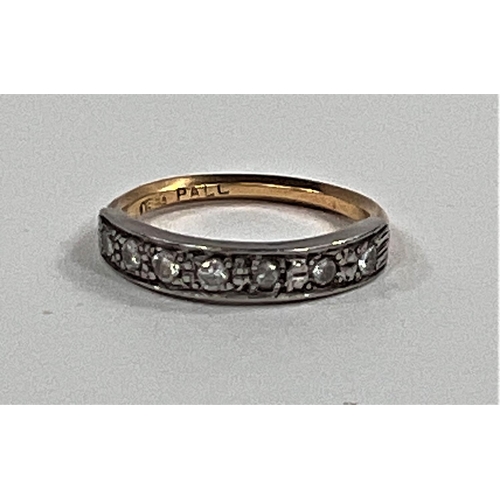 627 - A half eternity ring set with 7 small diamonds on yellow metal shank, stamped 18ct, size K, 2.4gms