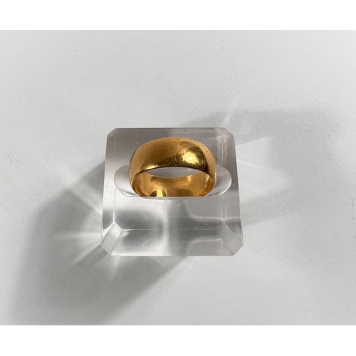 639 - A small wide barrel shaped 22 carat hallmarked gold wedding ring, 6gm