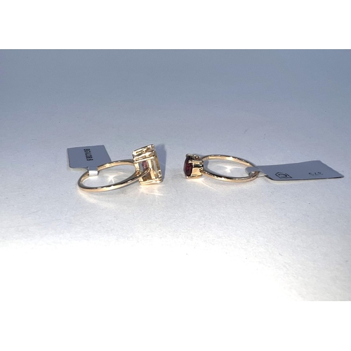 663 - 2 9 carat hallmarked gold dress rings, 1 set with a Malawi Garnet 1.21 carats, the other with a pale... 