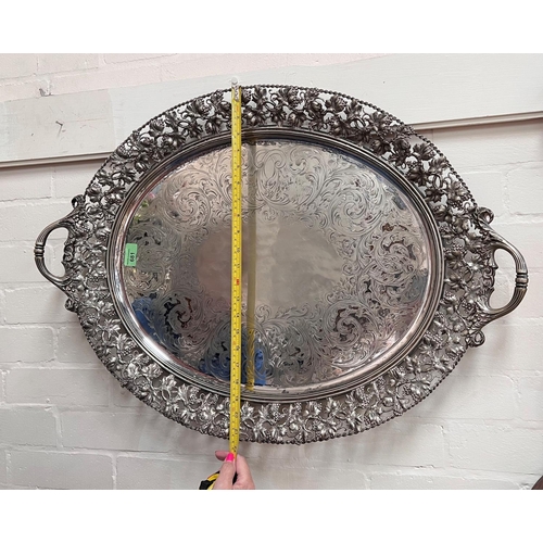 681 - A 19th century silver plated large oval tray with pierced vine border and chased decoration, length ... 