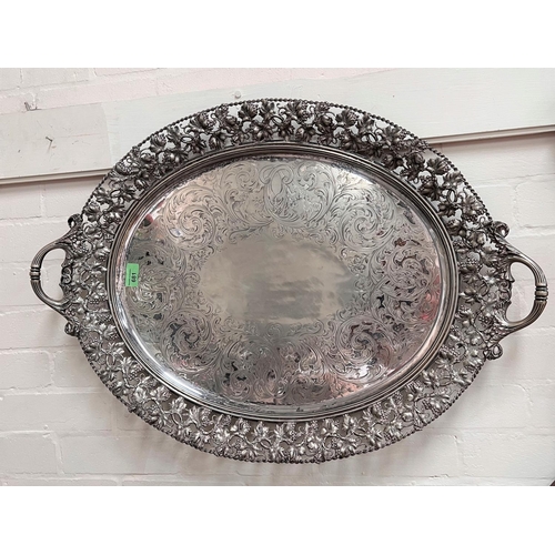 681 - A 19th century silver plated large oval tray with pierced vine border and chased decoration, length ... 