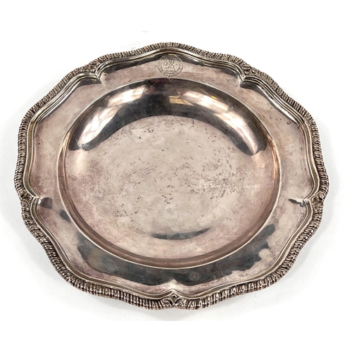 700 - A Georgian hallmarked silver shallow dish with gadrooned wavy rim, monogrammed, London 1817, maker J... 