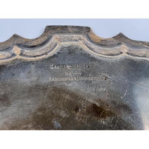 701 - A Georgian style hallmarked silver salver with wavy rim, with presentation inscription, Sheffield 19... 