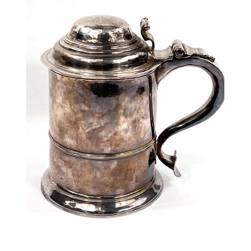 707 - A mid Georgian hallmarked silver quart tankard of ribbed cylindrical form, with hinged lid and swell... 