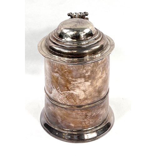 707 - A mid Georgian hallmarked silver quart tankard of ribbed cylindrical form, with hinged lid and swell... 