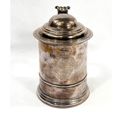 708 - An early Georgian hallmarked silver quart tankard of ribbed cylindrical form, with domed hinged lid ... 