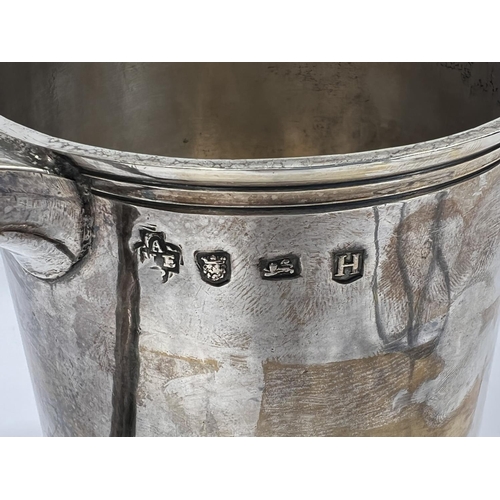 708 - An early Georgian hallmarked silver quart tankard of ribbed cylindrical form, with domed hinged lid ... 