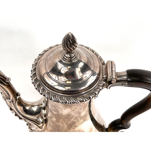 709 - A Georgian hallmarked silver baluster coffee pot with gadrooned rim and circular foot, acanthus leav... 