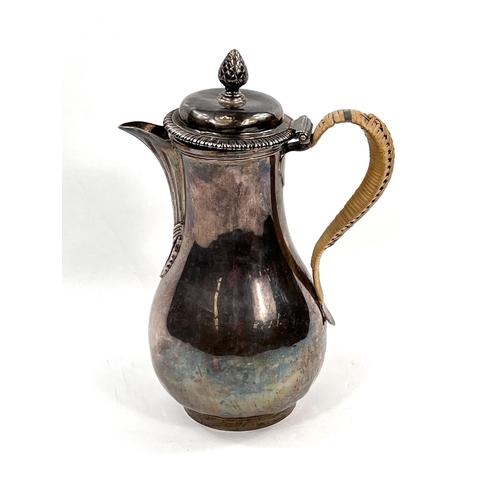 710 - A Georgian hallmarked silver baluster coffee pot with pineapple finial, gadrooned rim, reeded spout,... 