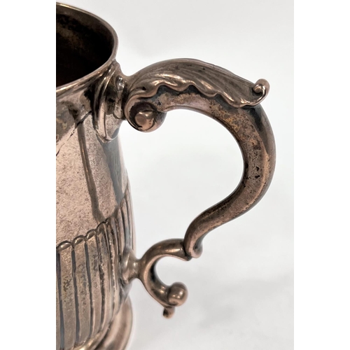 722 - A hallmarked silver baluster half pint mug with reeded lower body, on circular foot, inscribed to ba... 