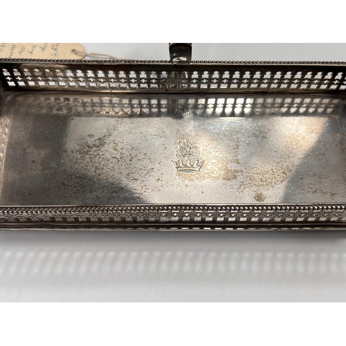 752 - An 18th century silver 'snuffer'/serving tray with beaded and pierced gallery, decorative handle and... 