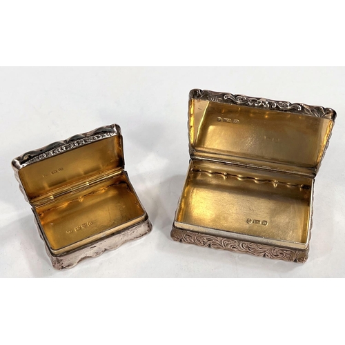 756 - Two Victorian silver snuff boxes with scrolled decoration and gilded interiors, presentation inscrip... 