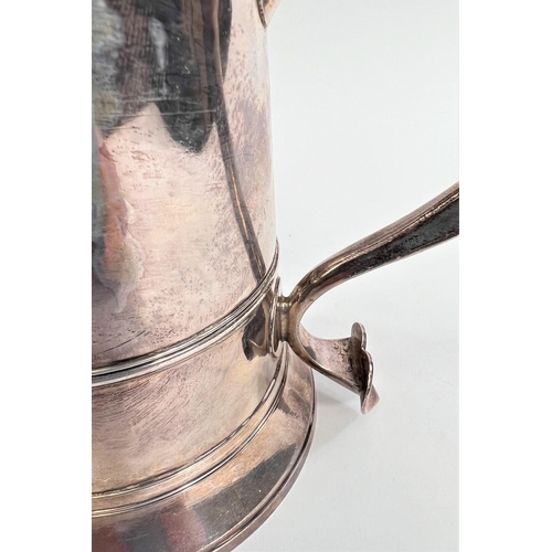 772 - An 18th century silver tankard with domed hinge lid, shaped handle with heart shaped scrolling termi... 