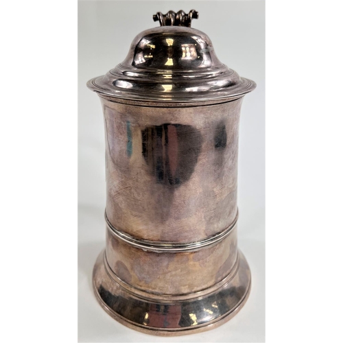 772 - An 18th century silver tankard with domed hinge lid, shaped handle with heart shaped scrolling termi... 