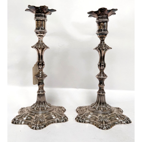 773 - A pair of Georgian Rococo candle sticks London 1821 Joseph Craddock William K. Reid 42.7oz (1327gm)