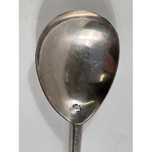 774 - An early 17th century silver apostle spoon with gilt apostle finial London 1603 maker's mark double ... 