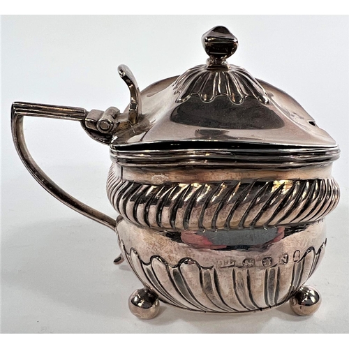 783 - A George III silver mustard pot, boat shaped, parcel gilt interior, gadrooned frieze, London, 1808, ... 