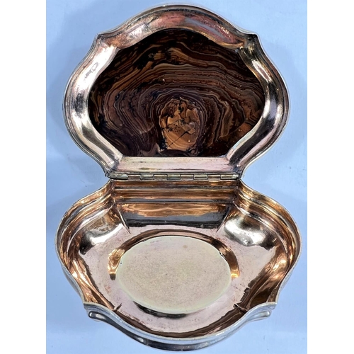 784 - A 19th century continental silver snuffbox of cushion form, polished veined agate to lid, reeded bor... 