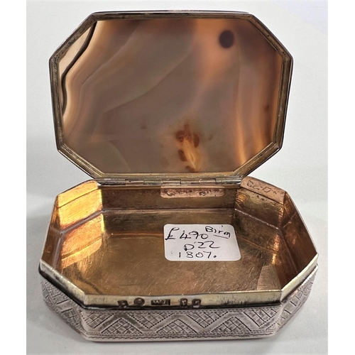 796 - An early 19th century silver snuff box inset agate top of shaped octagonal form, parcel gilt interio... 