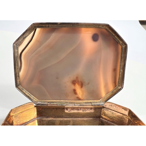 796 - An early 19th century silver snuff box inset agate top of shaped octagonal form, parcel gilt interio... 