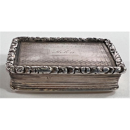 805 - A William IV parcel gilt silver vinaigrette of rectangular form with raised floral border, Birmingha... 