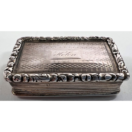 805 - A William IV parcel gilt silver vinaigrette of rectangular form with raised floral border, Birmingha... 