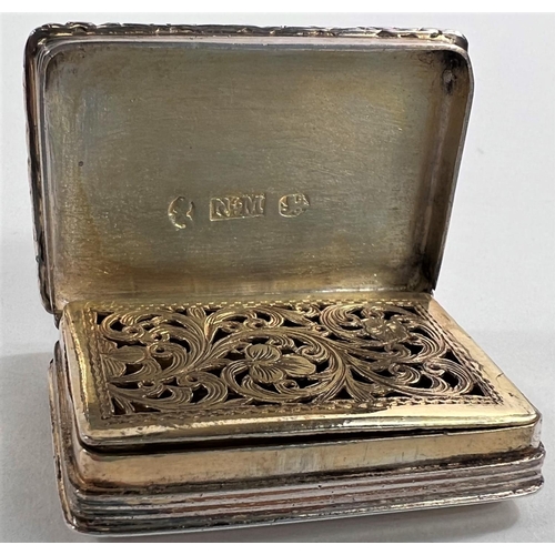 805 - A William IV parcel gilt silver vinaigrette of rectangular form with raised floral border, Birmingha... 