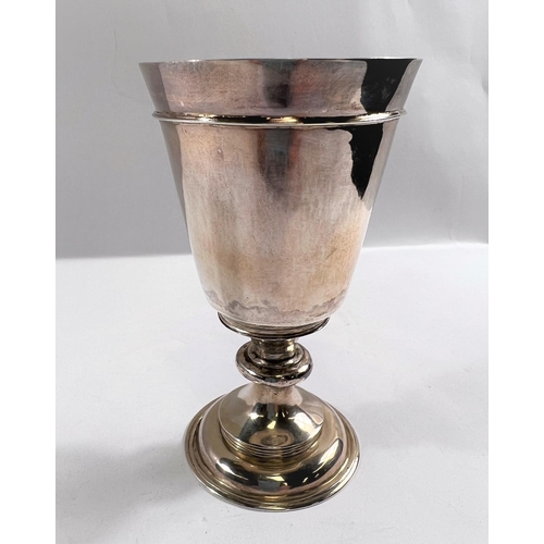 814 - An 18th century silver chalice of plain form with knopped stem and shallow domed foot, the conical b... 