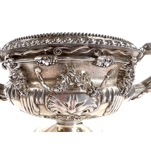 816 - A William IV silver and parcel gilt two handled vase modelled after the Warwick Vase, reeded and aca... 