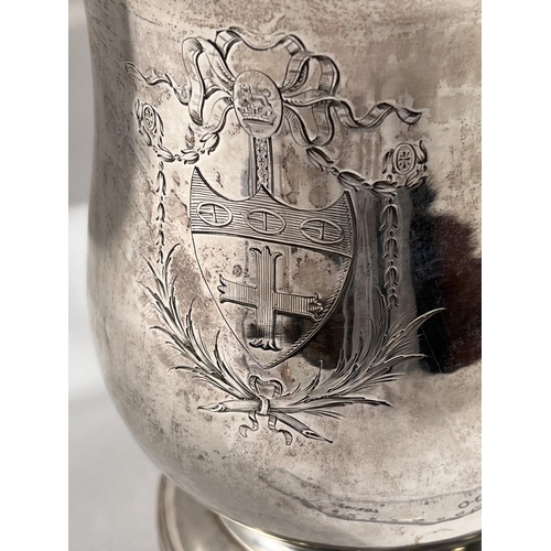 821 - An 18th century IRISH silver THREE PINT covered tankard of baluster form with domed lid having acant... 