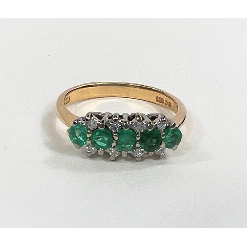 827 - An 18ct gold dress ring with five emeralds, with 8 diamond chips to the outside, 3.8gm