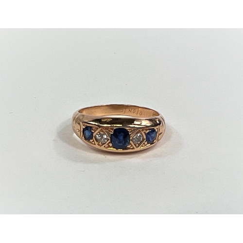 827A - A Victorian 18ct gold dress ring with 3 sapphires and two diamonds