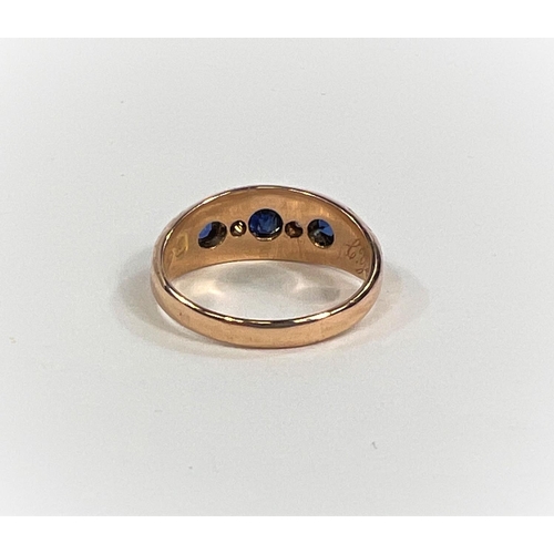 827A - A Victorian 18ct gold dress ring with 3 sapphires and two diamonds