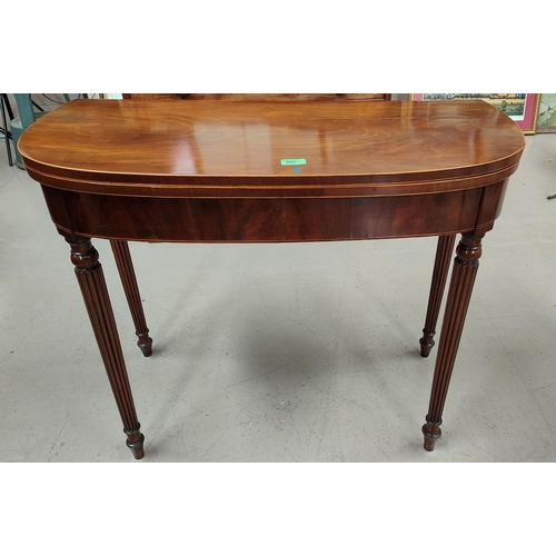 907 - A late 18ith century mahogany card table with boxwood and ebony line inlay, the 'D' fold-over top wi... 