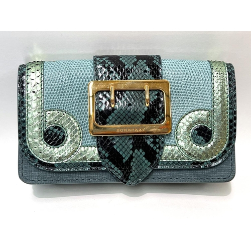 91 - BURBERRY - a purse/small clutch with snakeskin and leather in various shades of green, large gilt fr... 